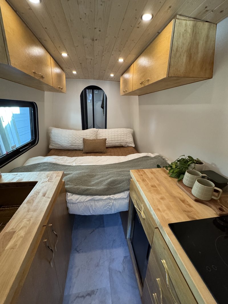 Anchor Sprinter interior living space with custom cabinetry