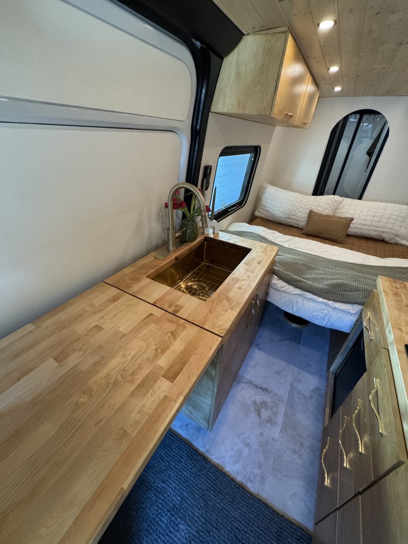 Anchor Sprinter custom kitchen with cooktop and refrigerator