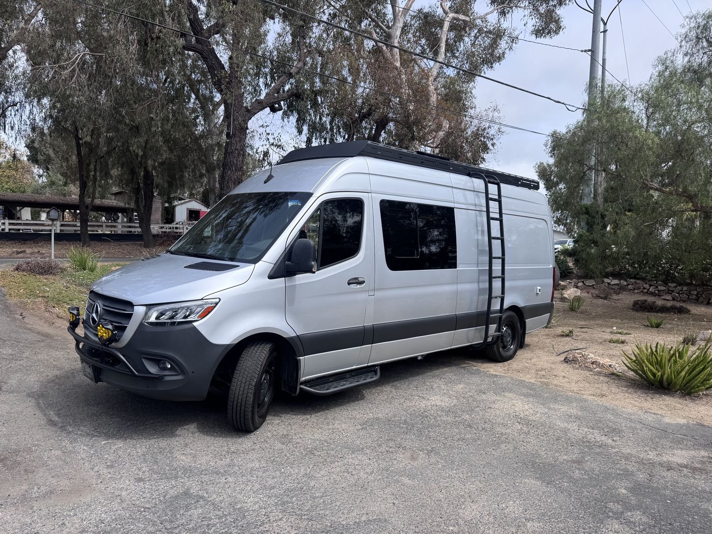 Grove Sprinter 170 Extended exterior in silver with black roof rack, side ladder and amber LED pods