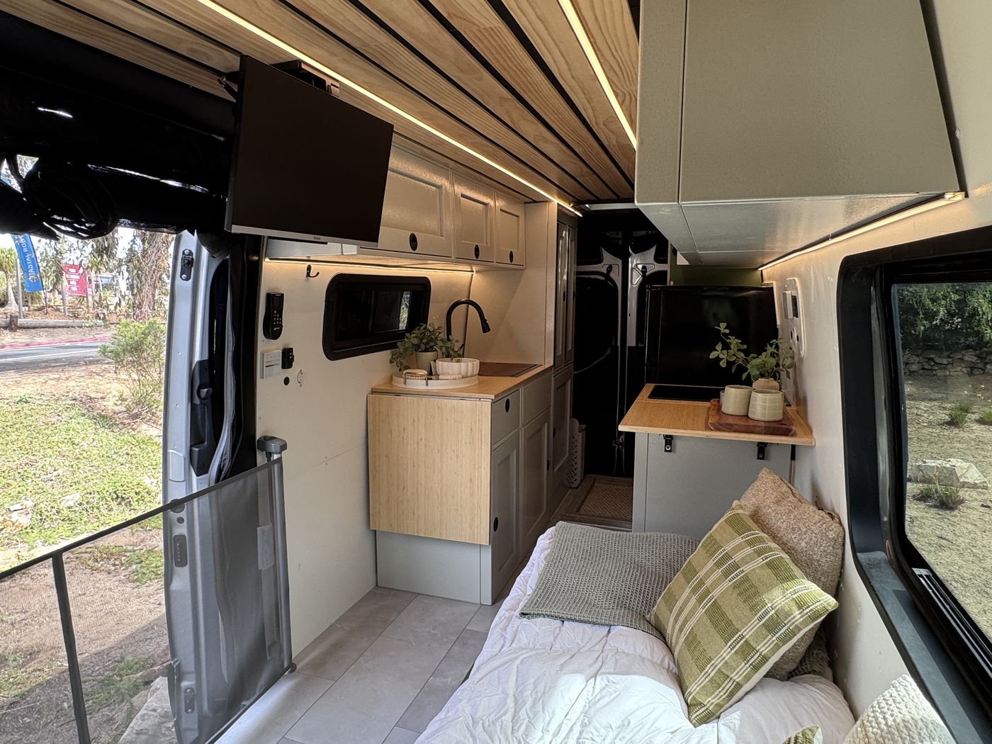 Grove Sprinter van galley with bamboo counters, Sandstone aluminum cabinetry and pine slat ceiling