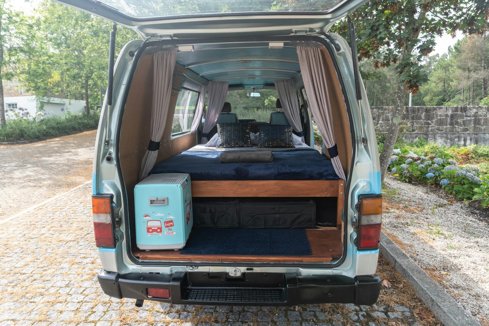 Interior of a van conversion showing insulated walls and build in progress